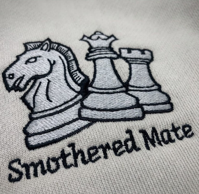Smothered Mate knight, queen and rook embroidered streetwear hoodie embroidery close-up view
